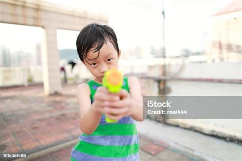 Children Playing With Squirt Gun Stock Photo Download Image Now