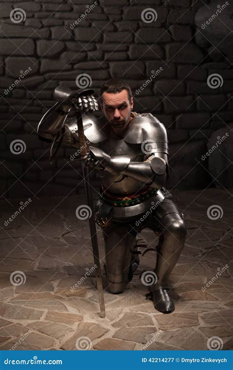 Medieval Knight Kneeling With Sword Stock Image Image Of Dark Length