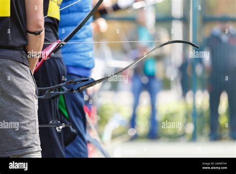 Longbow Archer Holds Modern Sport Bow With Arrow On Outdoor Sport