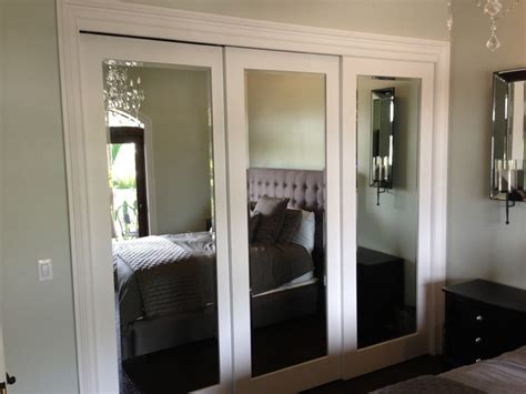 Sliding mirrored closet doors are especially useful in guest bedrooms to create a sense of more space paired with a luxury feel. Sliding doors - Contemporary - Bedroom - Miami - by Metro ...
