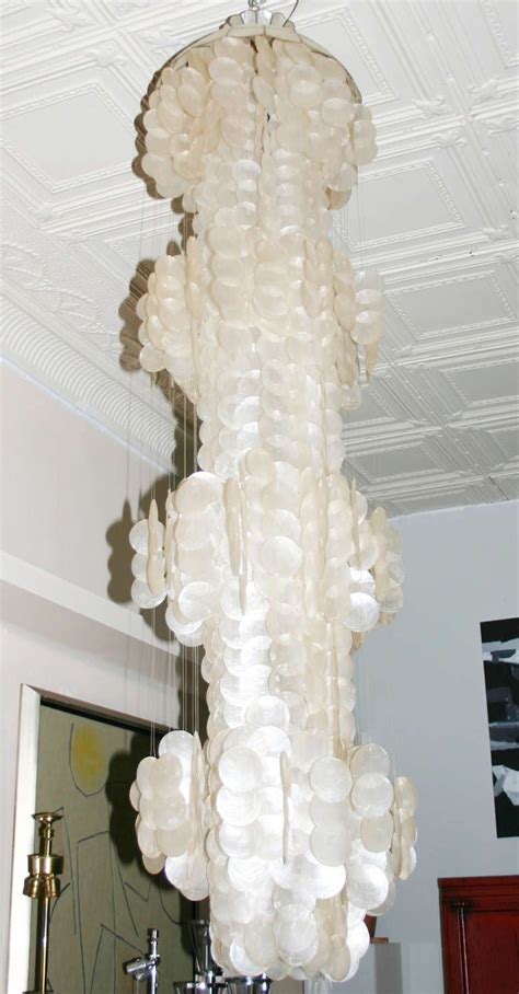 Tall drop chandelier casts moody, warm light through its more than 600. Capiz Shell Chandelier at 1stdibs