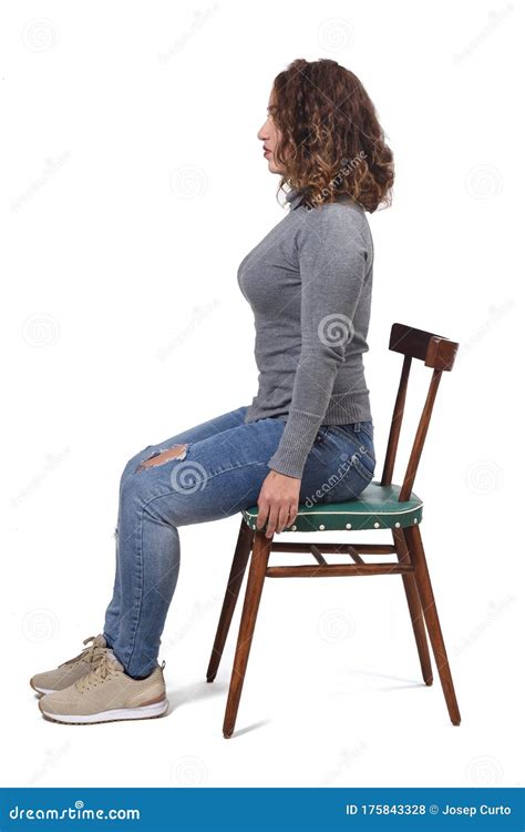 Portrait Of A Woman Sitting On A Chair In White Background Profile