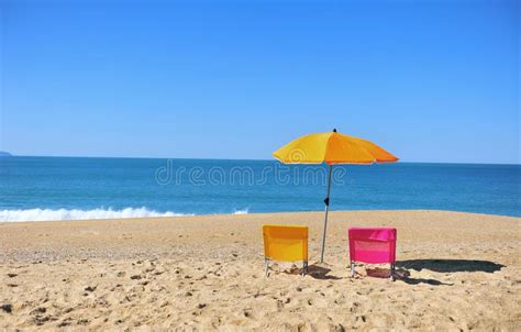 Two Colorful Beach Chairs With Blue Sea Water Stock Image Image Of