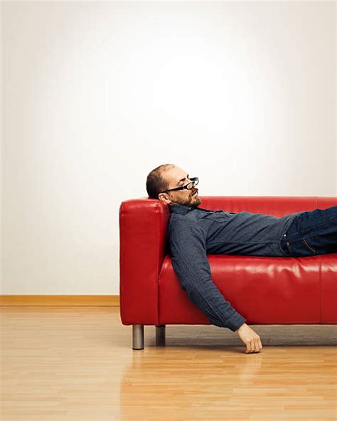 Man Sleeping In Armchair Stock Photos Pictures And Royalty Free Images
