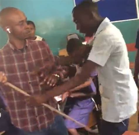 Student Causes Buzz Online As He Drags Cane With Male Teacher