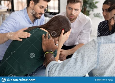 Crying Millennial Female Having Problems Taking Part In Group Therapy