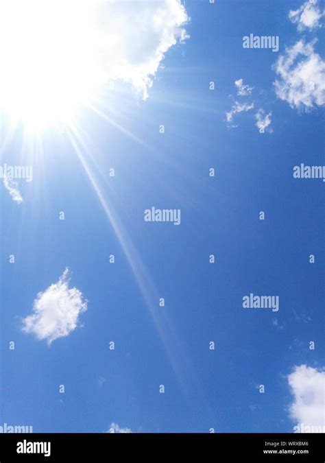 Sun Shining Through Clouds Stock Photo Alamy