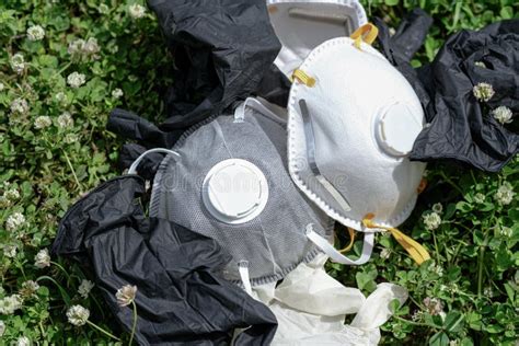 Ffp Protective Mask And Gloves Refuse Trash On Grass Meadow Ground Covid Coronavirus Disease