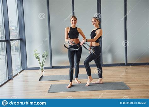 Standing Together Two Women In Sportive Wear And With Slim Bodies Have Fitness Yoga Day Indoors