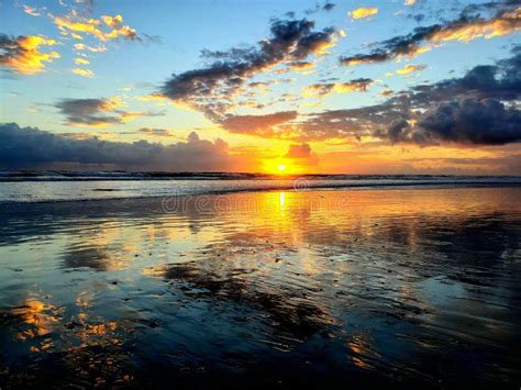 Gorgeous And Spectacular Sunrise On A Beautiful Beach Scene Stock Photo
