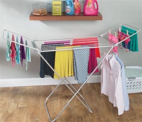 Lower it for loading, then hoist it up to dry washing where the warmth is and out of the way. 5 Essential Tips For Buying Clothes Drying Racks - Sad To ...