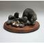 A Cold Cast Bronze Of Family Otters Sculpted By P J Dutt