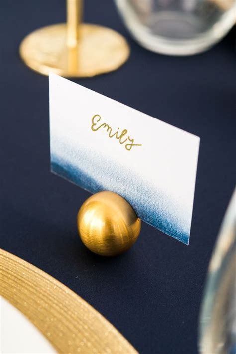 This Stylish Brushed Gold Place Card Holder Has An Understated Yet