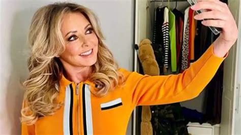 carol vorderman shows off her tiny waist and hourglass curves