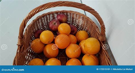 Oranges And Red Apples In A Basket Stock Image Image Of Oranges