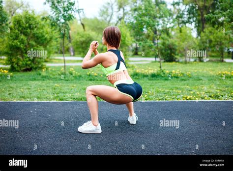 Page Woman Squatting Shorts High Resolution Stock Photography And