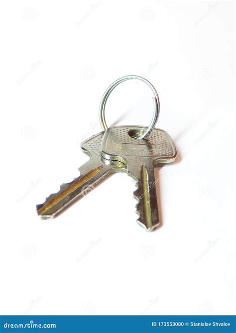 The Keys To The Lock Are Isolated On A White Background Stock Photo