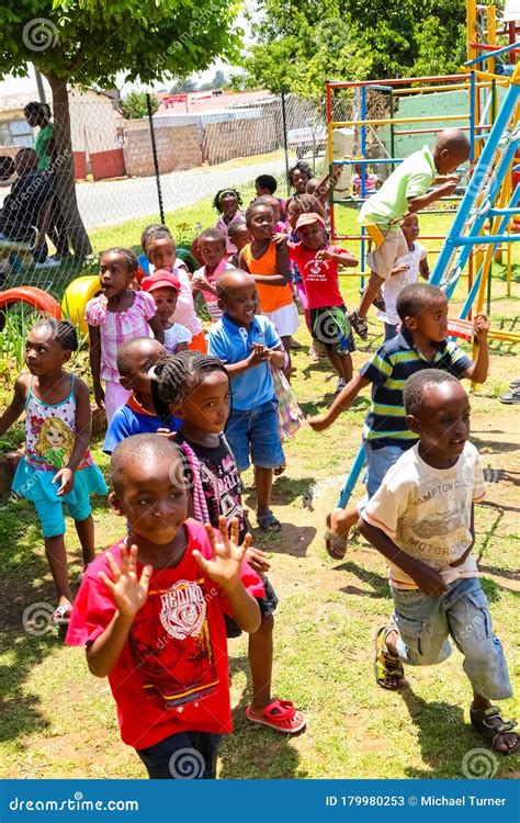 Young African Preschool Kids Playing In The Playground Of A