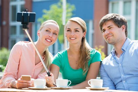 Friends Taking Selfie With Selfie Stick Stock Photo Image Of