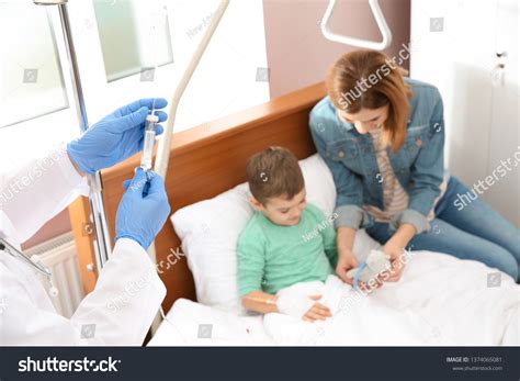 Doctor Adjusting Intravenous Drip Little Child Stock Photo 1374065081