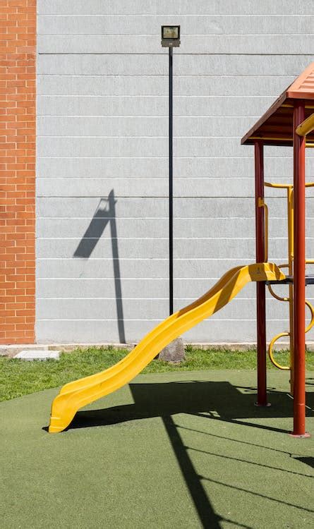 A Yellow Playground Slide · Free Stock Photo