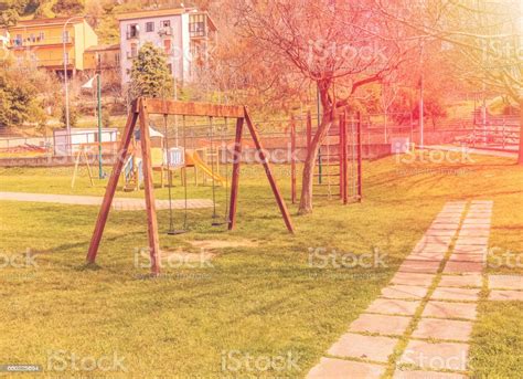 Empty Swings At Playground For Child Near Children Stairs Slides