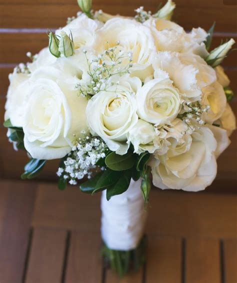 A Romantic Bouquet With Ivory Roses And White Gypsophilia