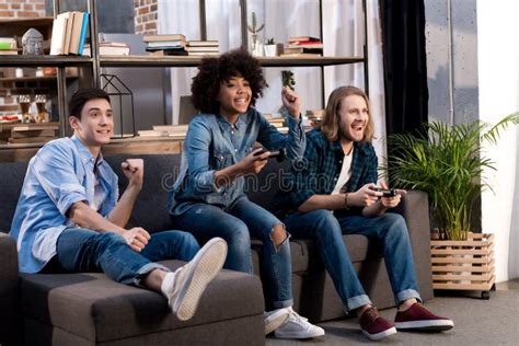 Multicultural Friends Playing Video Game Stock Image Image Of Indoors