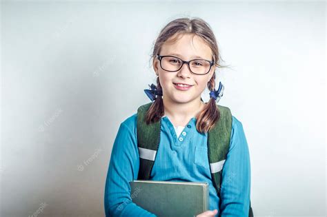 Premium Photo Girl Schoolgirl With Glasses With Books