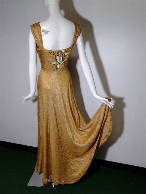 Lamé is also used for its conductive properties in the sport of fencing to make the overjackets (called lamés ) that allow touches to be scored. 1930s Gold Lame Bias Cut Gown w/ Sexy Lace-Up Back Detail and Full Hem For Sale at 1stdibs