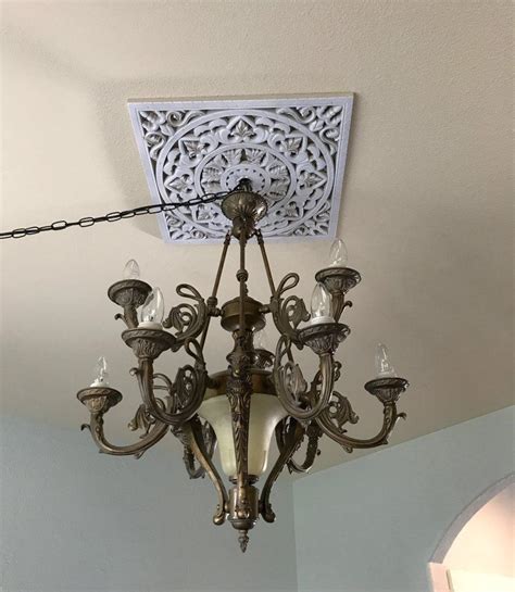 Creating a frame around the light's canopy. Checking Off My Checklist: Project #4 | Diy ceiling, Wooden wall hangings, Ceiling medallions