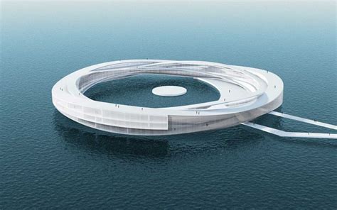 An Aerial View Of A Circular Building In The Middle Of The Ocean With