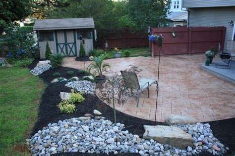 Combination Of Rich Black Mulch And Stones Enables A Natural Looking