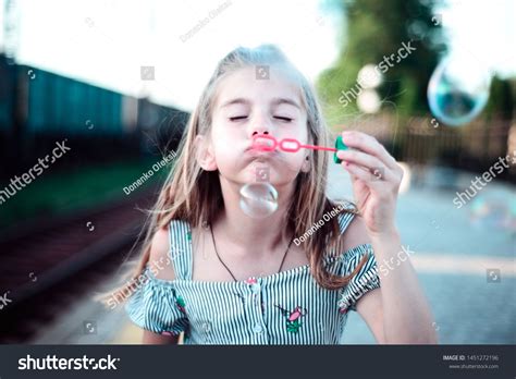 Portrait Beautiful Little Girl Blowing Bubbles Stock Photo 1451272196