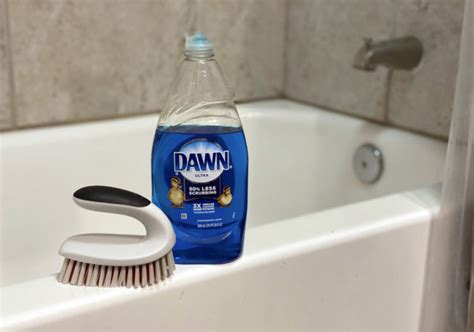 Clean Your Bathtub With A Broom And Dish Soap