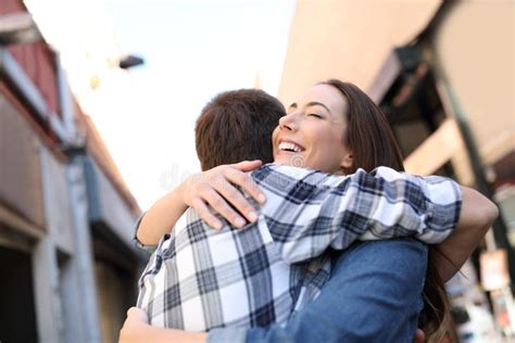 Joyful Couple Hugging In The Street After Meeting Stock Image Image