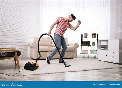 Man Using Vacuum Cleaner At Home Stock Image Image Of Dust Appliance 182622649