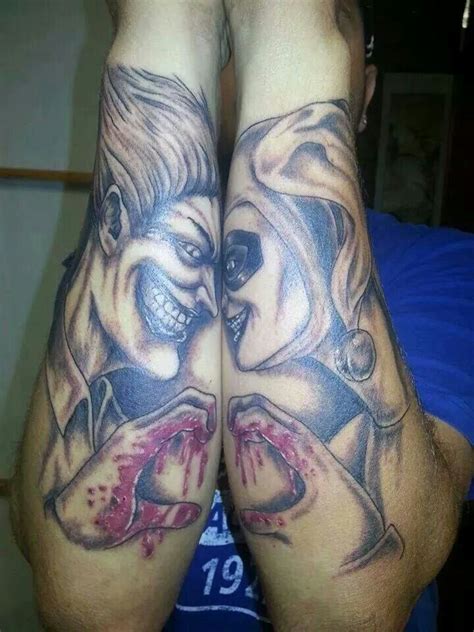 Two People With Tattoos On Their Legs