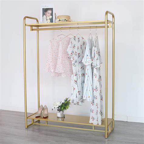 Amazon Com HOMEKAYT Gold Clothing Rack Modern Boutique Display Rack