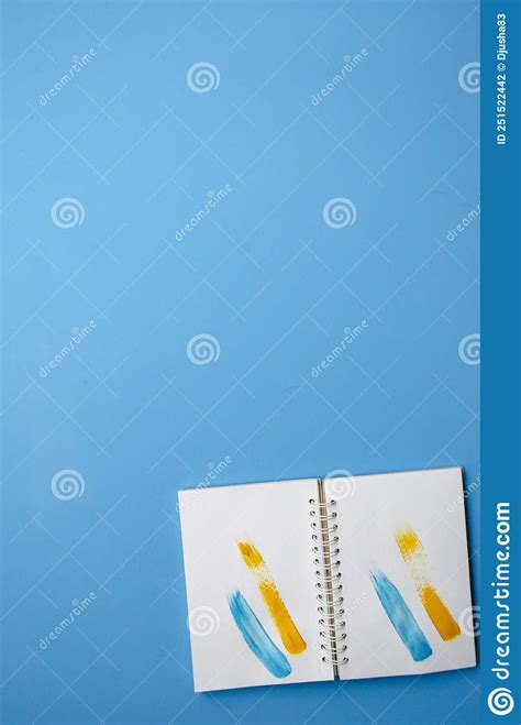 Flatlay Vertical Composition Open Notebook With Yellow And Blue Strokes