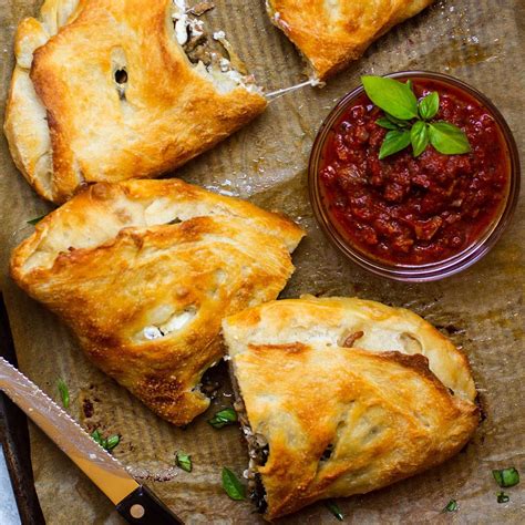 Goat Cheese Basil And Italian Sausage Calzones