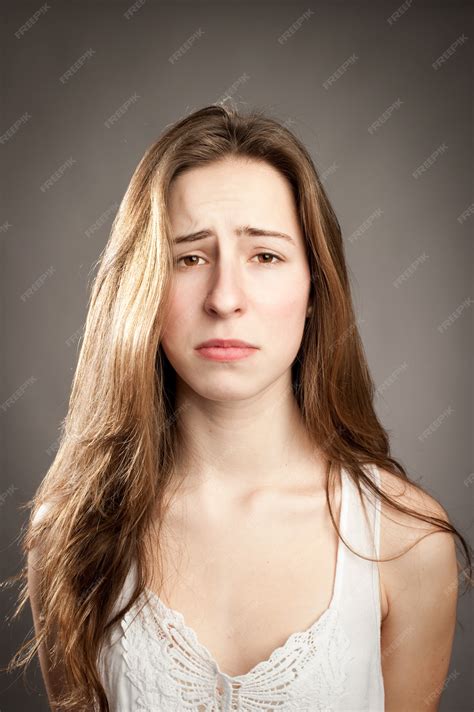 Premium Photo Young Girl With Sad Expression