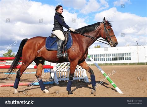 Young Beautiful Girl Riding A Running Horse Stock Photo