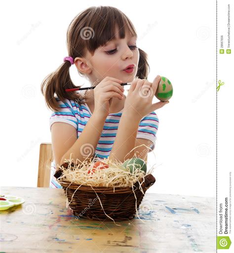 A Happy Little Girl Coloring Easter Egg Stock Photo Image Of Cute