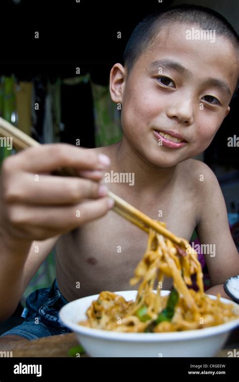 Chinese Kid Eating Noodles Pingyao Shaanxi Province China Stock