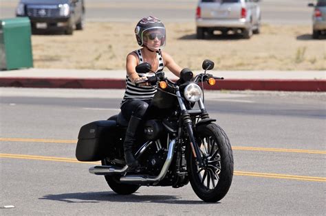 With motorcycles, we tend to behave as if there's no middle ground — either you're riding or you're not. Pink Photos Photos - Pink Rides Her Motorcycle - Zimbio