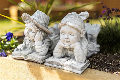 Buy Homezone Boy And Girl Laying And Reading Garden Ornaments Outdoor