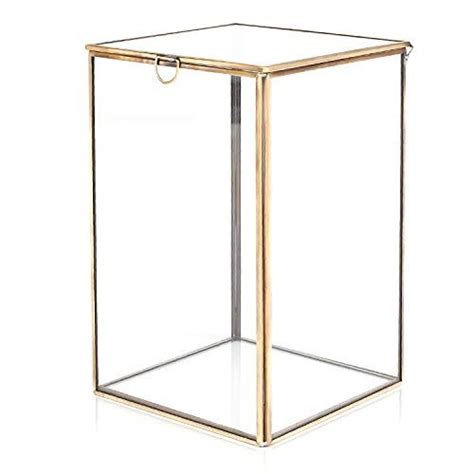 A Glass Box With A Metal Handle On The Top And Bottom Sitting In Front Of A White Background