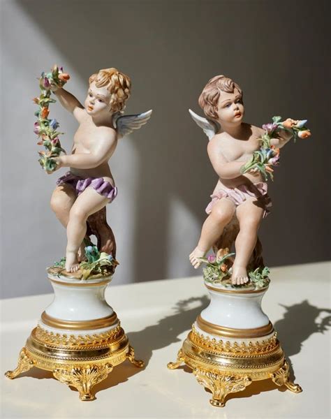 Pair Of Porcelain Capodimonte Cherubs 20th Century Polychrome Putti