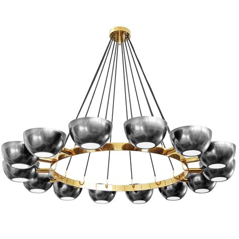 Installing adequate lighting is always a priority for homeowners to brighten dark rooms and add beauty to their home. Custom Chandelier in the Style of Stilnovo For Sale at 1stdibs